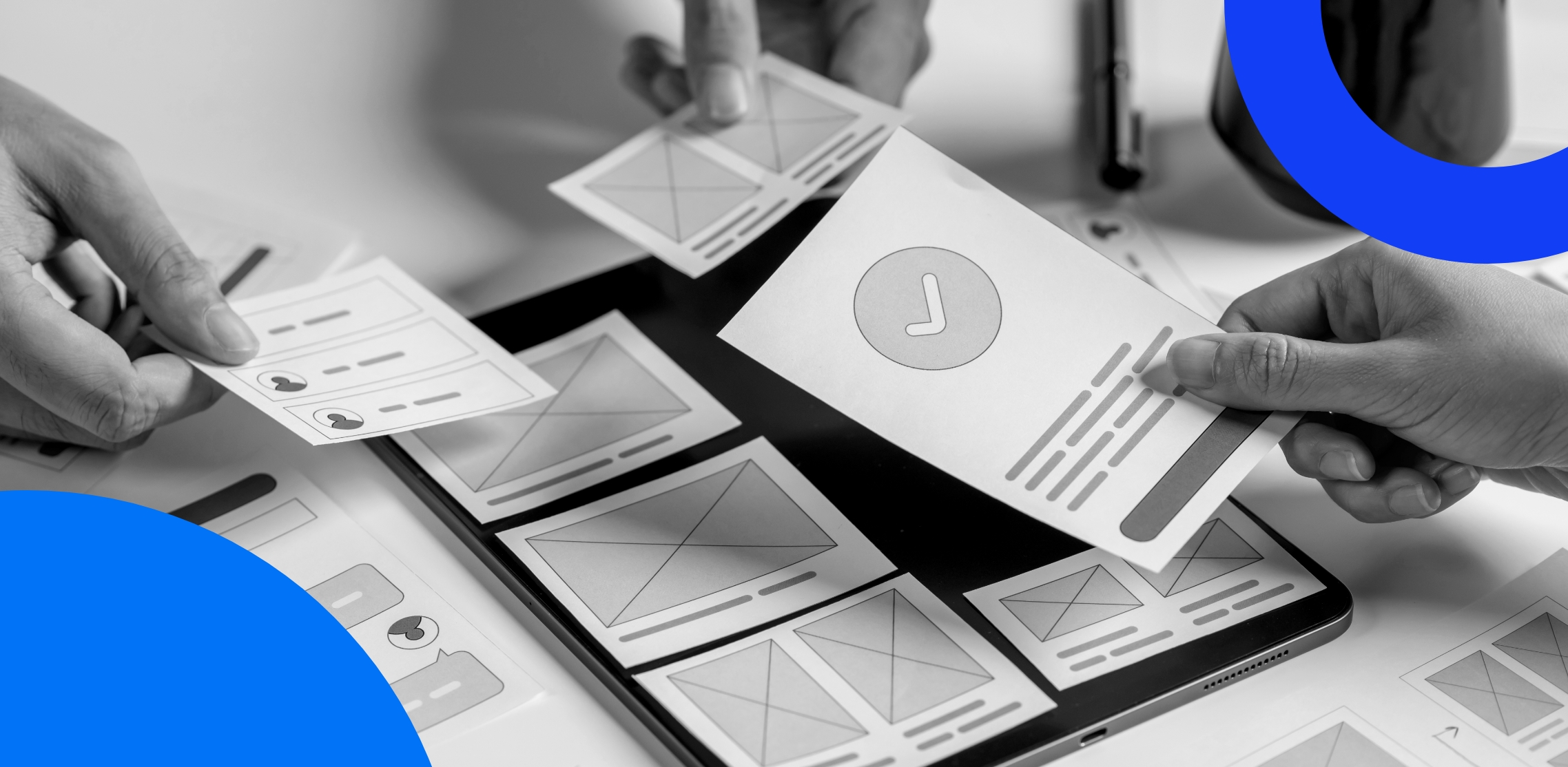 People holding paper cutouts of website usability elements 